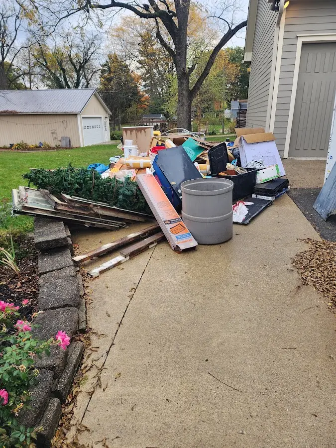 Dumpster being loaded with debris for 30 Yard Dumpster Rental in Port Salerno
